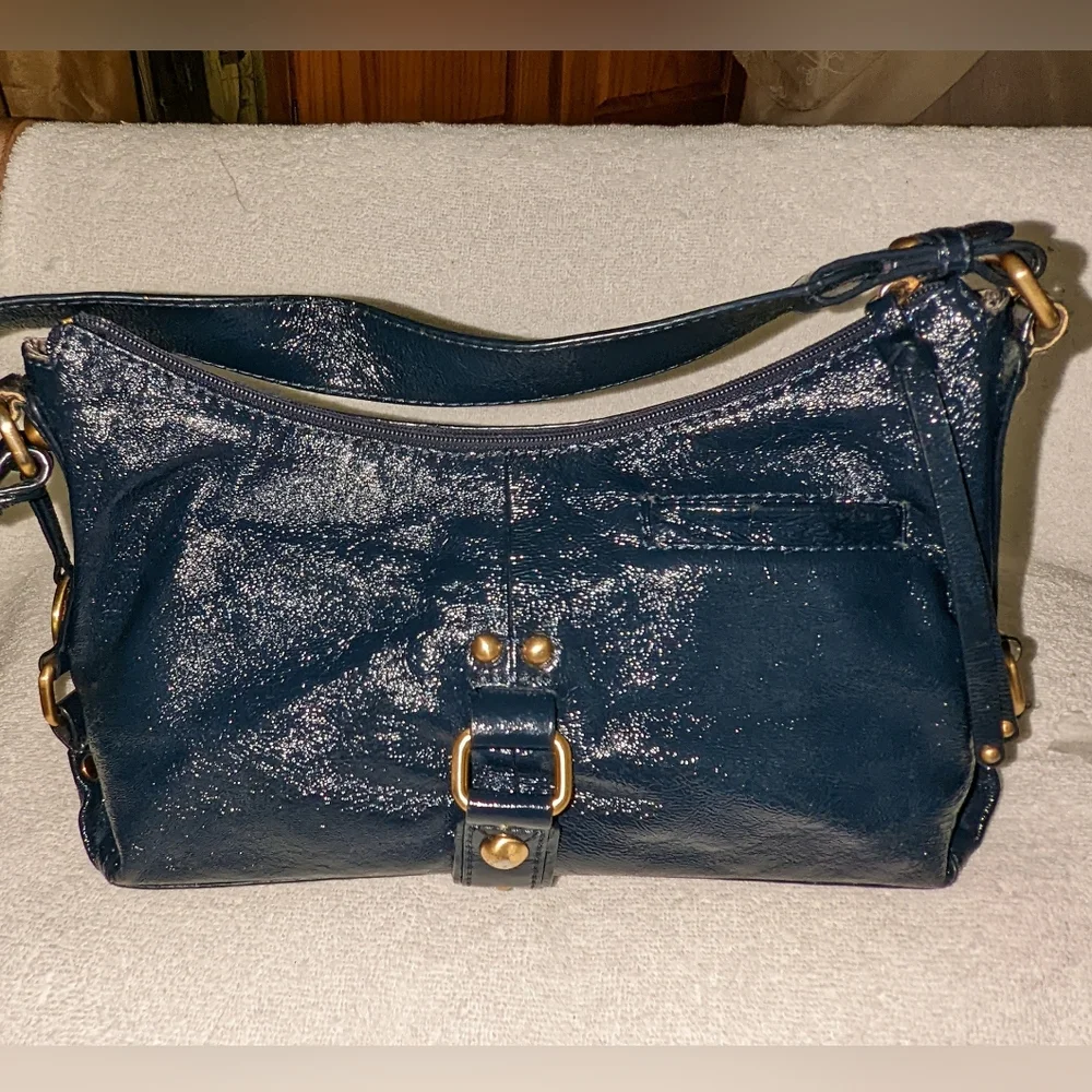 The  Sak navy blue patent leather hobo bag.